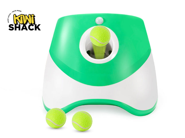 Green and white tennis ball launcher with tennis balls on a white background, featuring the Kiwi Shack brand.
