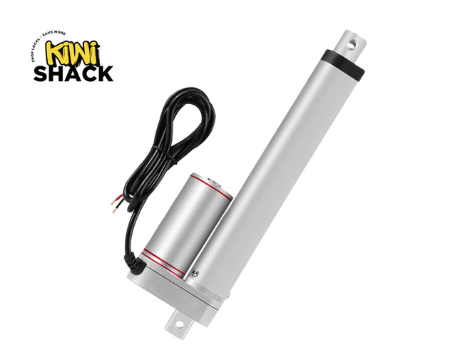 A silver linear electric motor with an attached black power cable, shown on a plain white background with the Kiwi Shack logo in the top-left corner.