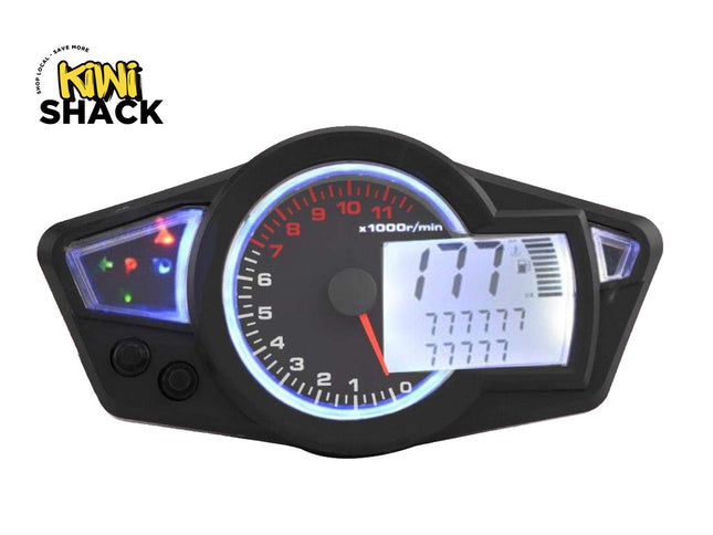 A black motorcycle or scooter dashboard instrument cluster with a tachometer, illuminated blue ring, and a digital display screen, shown on a white background with a Kiwi Shack logo in the top-left corner.