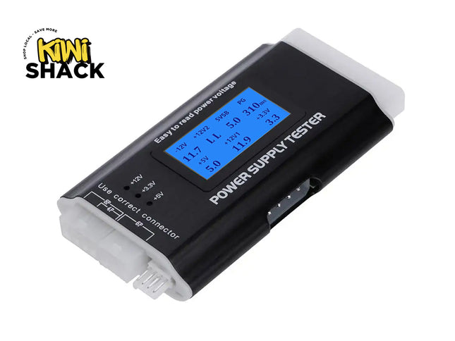 A digital PC power supply tester with a black housing, an LCD screen displaying voltage readings, and various input ports on the ends against a white background, featuring the "Kiwi Shack" logo in the upper left corner.