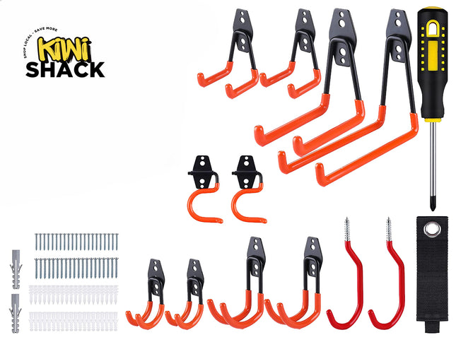 A comprehensive heavy-duty garage storage utility hook set featuring various sizes of orange and black steel wall-mount hooks, a screwdriver, installation screws, wall anchors, and a storage strap, with a "Kiwi Shack" logo in the top left corner.