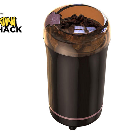 Coffee grinder with coffee beans on a white background, featuring the Kiwi Shack logo.