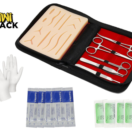 Medical training kit with a brain model, scissors, gloves, and bandages on a white background.