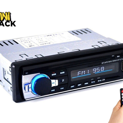 A single-DIN car stereo head unit with a digital display, glowing blue volume knob, USB port, and a small wireless remote control held in a hand, featuring the "Kiwi Shack" logo in the top-left corner.
