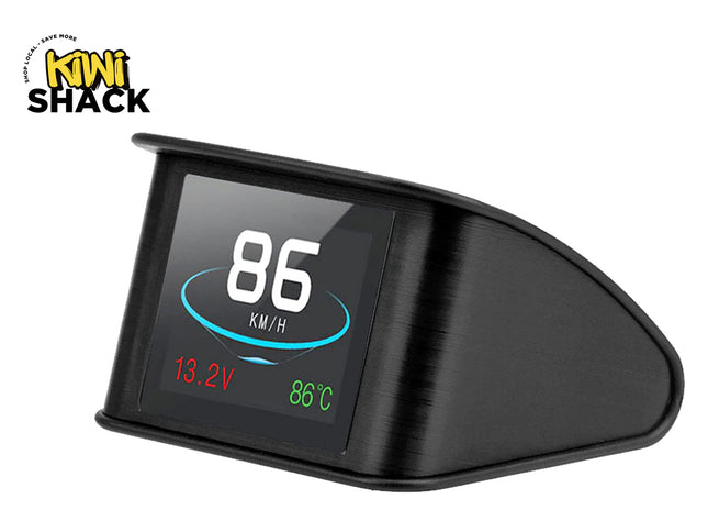 A black automotive dashboard display screen showing speed, battery voltage, and temperature, with the Kiwi Shack logo in the top-left corner.