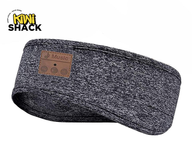 A dark gray heathered wireless running headband with a brown faux-leather patch labeled 'Music' on the side, shown on a white background with the Kiwi Shack logo in the top-left corner.