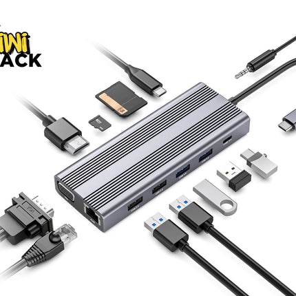 A silver aluminum USB-C hub with multiple ports and several attached and displayed accessories including cables, a USB drive, a SD card, and a keychain tool, on a white background with the Kiwi Shack logo.