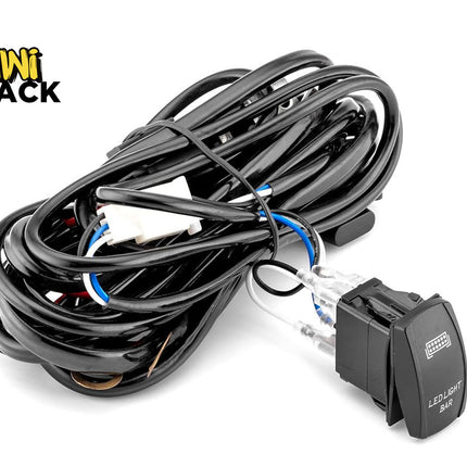 An automotive LED light bar wiring harness kit with a heavy-duty rocker switch and coiled wiring, featuring the "Kiwi Shack" logo in the top-left corner.