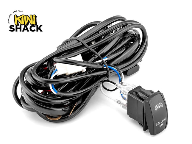An automotive LED light bar wiring harness kit with a heavy-duty rocker switch and coiled wiring, featuring the "Kiwi Shack" logo in the top-left corner.