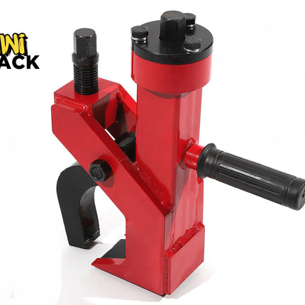 A red and black heavy-duty manual bead breaker tool with a gripping jaw, adjustable bolt, and a side handle, featuring a "Kiwi Shack" logo in the top left corner.