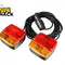 A pair of magnetic towing trailer lights with red and amber lenses, connected by a long wiring cable and a 7-pin plug, featuring the "Kiwi Shack" logo in the top-left corner.