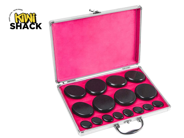 Set of black stones in a silver case with pink interior, branded 'Kiwi Shack'.