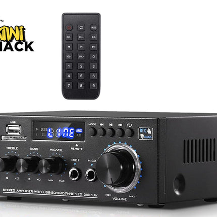 Black audio amplifier with remote control on a white background, featuring the Kiwi Shack logo.