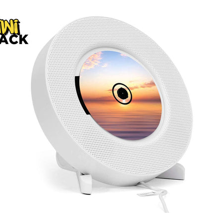 Round white device with a screen displaying a sunset, branded 'Kiwi Shack'.