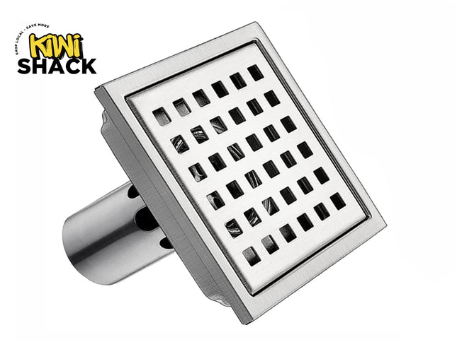 Kiwi Shack brushed nickel stainless steel square shower floor drain with removable grid strainer.