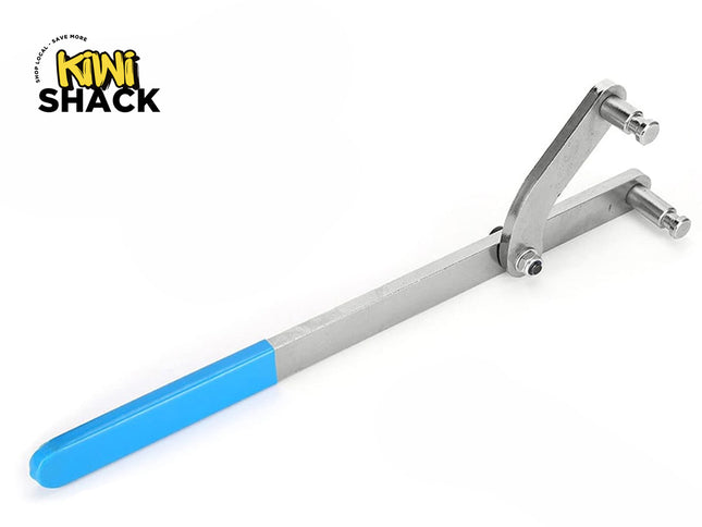 An adjustable pin spanner wrench with a metal handle, dual protruding pins, and a bright blue dipped rubber grip, featuring a "Kiwi Shack" logo in the top left corner.