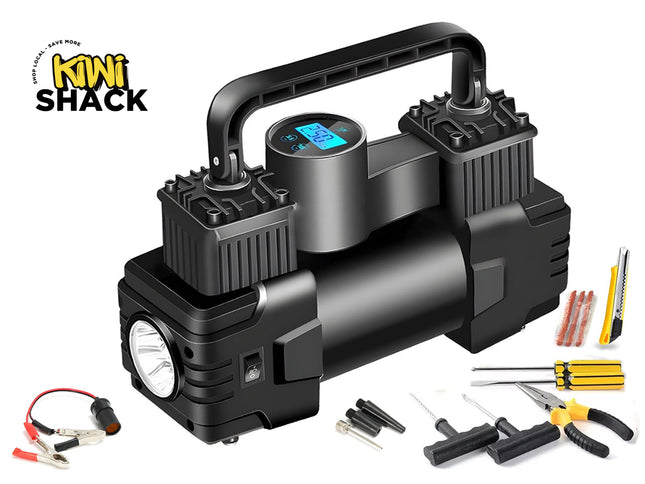 A heavy-duty portable air compressor pump and tire repair kit with a black dual-cylinder unit, a built-in digital display gauge, an integrated LED flashlight, battery clamps, a utility knife, screwdrivers, pliers, and tire plugging tools against a white background, featuring the "Kiwi Shack" logo in the upper left corner.