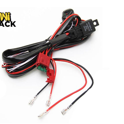 An automotive wiring harness kit with a relay, inline fuse holder, switch, and connector leads, featuring the "Kiwi Shack" logo in the top-left corner.