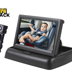 Black car rear-view mirror with an adjustable camera mount and a screen showing a baby in a car seat, on a white background with the Kiwi Shack logo.