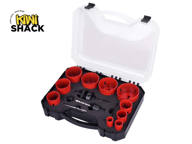 A set of red bi-metal hole saws of varying sizes with mandrels and pilot drill bits neatly arranged in a black storage case with a clear lid, set against a white background. A "Kiwi Shack" logo appears in the top-left corner.
