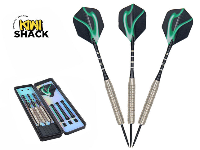 Set of three steel-tipped darts with knurled silver barrels, black shafts, and black-and-green abstract patterned flights, shown alongside an open black hard-shell storage case, featuring Kiwi Shack logo in top left.