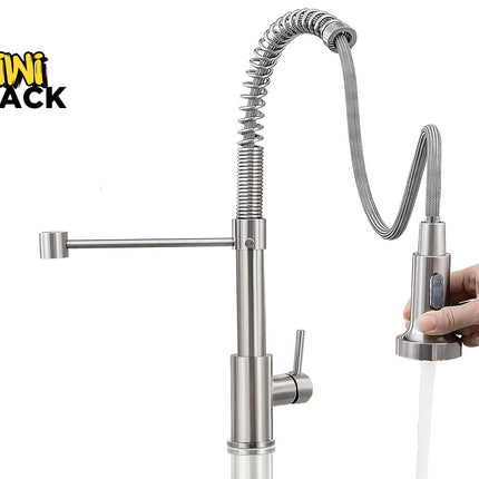 A stainless steel kitchen faucet with a flexible gooseneck sprayer and a side arm, shown with a hand holding the pull-out spout under running water. The Kiwi Shack logo is visible in the top left corner.
