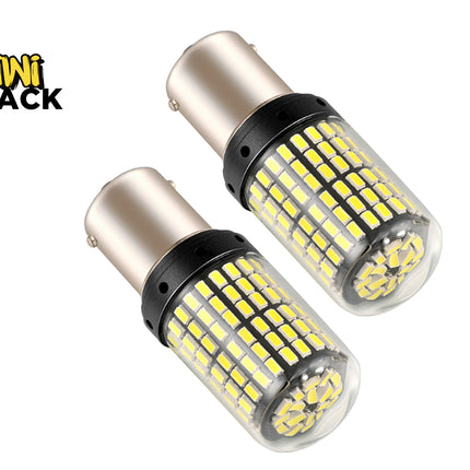 A pair of high-output automotive LED replacement bulbs featuring dense rows of yellow chips encased in protective transparent covers with metal bayonet bases, set against a white background. A "Kiwi Shack" logo appears in the top-left corner.