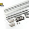 Heavy-duty sliding door track hardware set including extruded aluminum upper and lower tracks, tandem roller carriages, floor guides, and mounting brackets, with Kiwi Shack logo in top left.