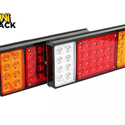 Pair of rectangular LED truck and trailer tail lights with black housings, featuring amber, red, and white/clear optical lens sections, branded with the "Kiwi Shack" logo in the top-left corner.