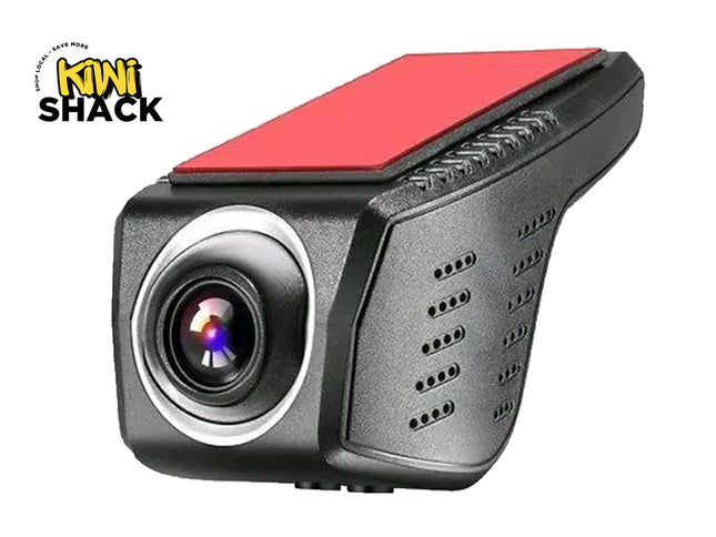 A black compact dashboard camera with a red adhesive mount pad on top, featuring the "Kiwi Shack" logo in the top-left corner.