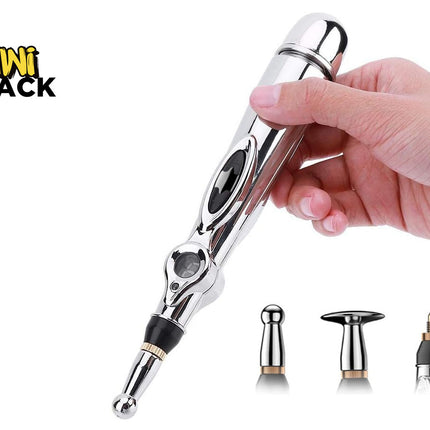 A handheld silver electronic acupuncture pen with an LCD display and interchangeable massage heads, held in a person's hand, featuring the "Kiwi Shack" logo in the top-left corner.