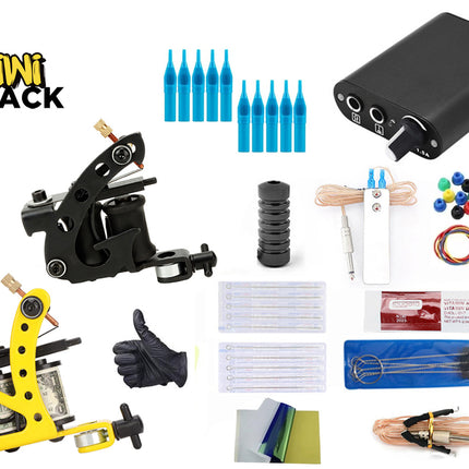 Tattoo kit components arranged on a white background, including a black and yellow tattoo machine, blue cartridge tips, a black battery, gloves, needles, ink cups, cords, and other tattooing accessories. The Kiwi Shack logo appears in the top left.