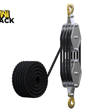 Heavy-duty multi-sheave block and tackle pulley system with top and bottom brass hooks, threaded multi-plate metal frame, reeved black rope threaded through multiple sheaves, a coiled coil of black rope on the left, and Kiwi Shack logo in top left.