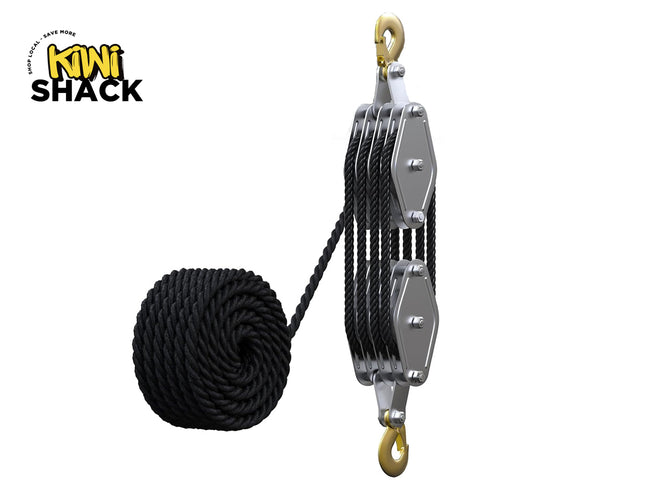Heavy-duty multi-sheave block and tackle pulley system with top and bottom brass hooks, threaded multi-plate metal frame, reeved black rope threaded through multiple sheaves, a coiled coil of black rope on the left, and Kiwi Shack logo in top left.