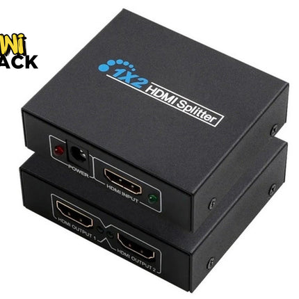 Two stacked black 1X2 HDMI Splitter metal boxes [cite: 2]. Top unit shows top-surface branding "1X2 HDMI Splitter" and front-facing DC power port with red LED, HDMI input port with green LED. Bottom unit shows front-facing HDMI Output 1 and HDMI Output 2 ports [cite: 2]. Kiwi Shack logo in top-left corner [cite: 2].