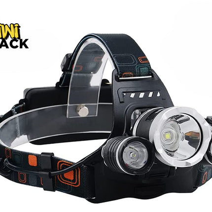 Black multi-LED headlamp with a central high-output emitter flanked by two smaller auxiliary lights, mounted on an adjustable geometric-pattern strap with a coiled power cord, branded with the "Kiwi Shack" logo in the top-left corner.