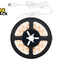 A coiled warm white LED strip light on a black spool with a white USB cable and controller, shown on a white background with the Kiwi Shack logo in the top-left corner.