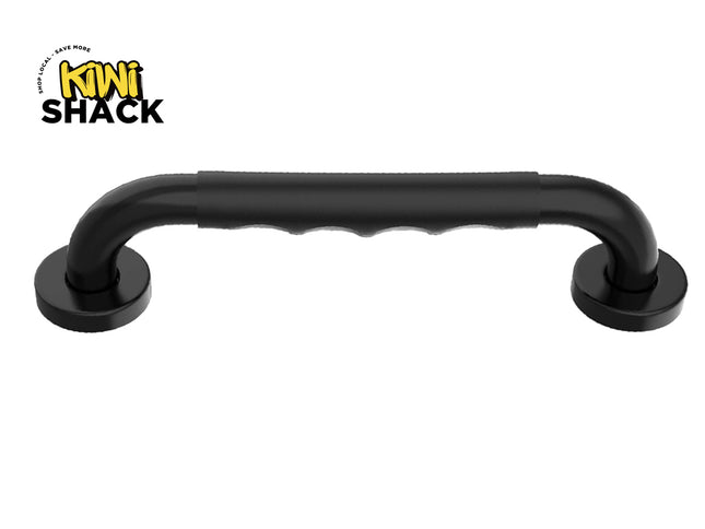 Matte black safety grab bar/handle with a contoured rubber grip section in the center and round flanged mounting bases at each end, featuring Kiwi Shack logo in top left.