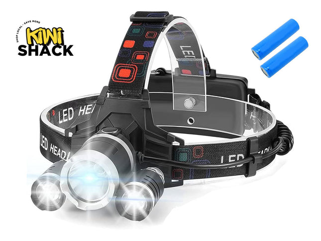 Black multi-LED headlamp with central bright beam and two side auxiliary lights, mounted on a patterned adjustable elastic strap with rear battery pack, accompanied by two blue 18650-style Li-ion batteries floating top-right, featuring Kiwi Shack logo in top left.