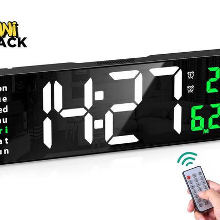 Large black rectangular digital LED wall/desk clock displaying white numbers showing time 14:21, green day-of-week indicator with "Fri" highlighted, green temperature display showing 29°C, green month/date display showing 6.23, accompanied by a hand holding a small infrared remote control with green signal waves, and the Kiwi Shack logo watermark.