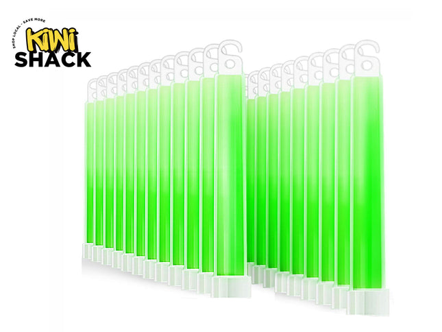 Bulk pack of glowing bright green LED safety baton traffic wands standing upright in parallel rows, each with a hanging hook top and white base, featuring Kiwi Shack logo in top left.