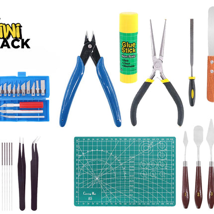 A comprehensive craft and hobby tool kit including an A5 green self-healing cutting mat, precision hobby knives with a storage case, wire cutters, needle-nose pliers, a glue stick, a small file, scrapers, tweezers, a set of fine files or needles, and an assortment of palette knives with wooden handles, set against a white background. A "Kiwi Shack" logo appears in the top-left corner.