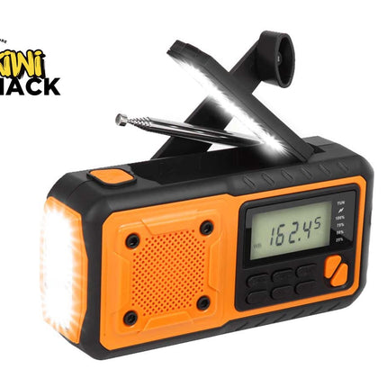 An orange and black Kiwi Shack portable emergency radio with built-in lights and a folding antenna, shown on a white background with the Kiwi Shack logo in the top-left corner.