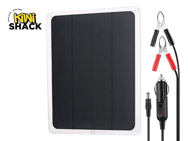 Solar panel with wiring and clamps on a white background, featuring the Kiwi Shack brand.