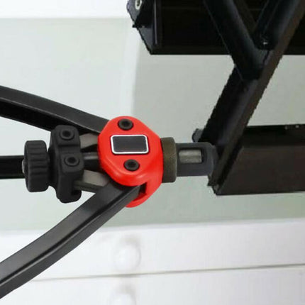Close-up of a red tool holder attached to a black metal frame on a white background