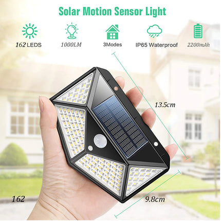 Solar motion sensor light held in hand with specifications displayed