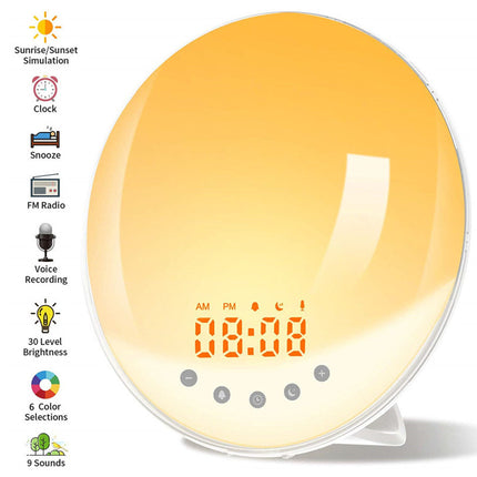 An oval sunrise alarm clock with a glossy yellow-to-orange gradient face, digital time display, and small feature icons. The left side lists included features such as sunrise simulation, clock, snooze, FM radio, voice recording, 30 level brightness, 6 color selections, and 9 sounds.