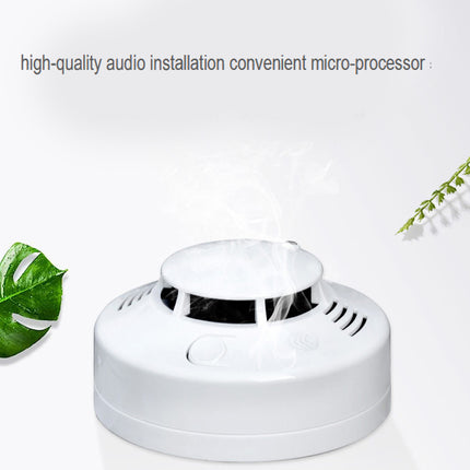 White electronic device with green leaves on a light gray background