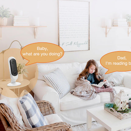 Living room with a child reading on a couch and a robot asking 'Baby, what are you doing?'