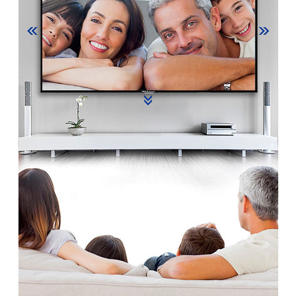 Family watching TV in a living room with a screen displaying a family photo.